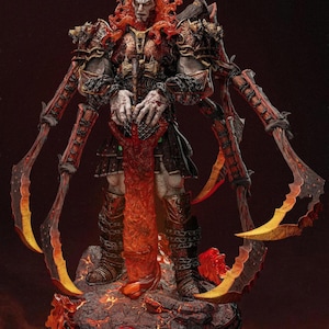 May include: A detailed figurine of a warrior with red hair and intricate armor. The figure holds a fiery weapon and is surrounded by curved blades. The base features a lava-like texture and a red Omega symbol.