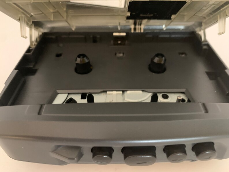 A classic Sony Walkman portable cassette player is displayed at the