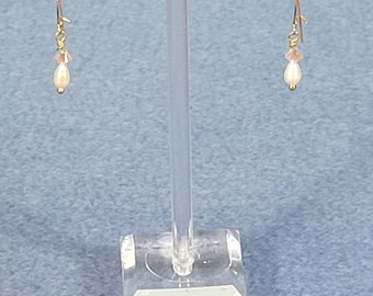 Lovely Swarovski crystals and freshwater pearl earrings sport comfortable sterling silver kidney ear wires