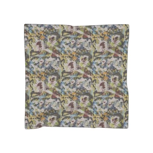 May include: A repeating pattern of abstract shapes in shades of blue, green, yellow, red, and brown. The pattern is on a white background.