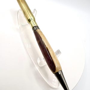 308 caliber shell casing twist pen with Gun-metal fittings and Poplar and Resin barrel.