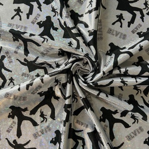 May include: Silver fabric with a repeating pattern of black silhouettes of Elvis Presley singing and the word "Elvis" printed in white.