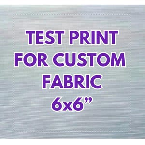 May include: A test print for custom fabric, with the text "TEST PRINT FOR CUSTOM FABRIC 6x6" in purple. The background is a light gray with subtle horizontal lines, and a square outline.