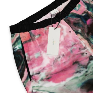 Pink and Black Abstract Print Unisex Track Pants, Paint Splash Track Pants, Mesh Lining, Water-Resistant.