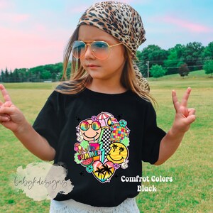 May include: Black t-shirt with a vibrant summer graphic, including smiley faces, a disco ball, and palm trees. The word "SUMMER" is part of the design. The shirt is labelled "Comfort Colors Black".