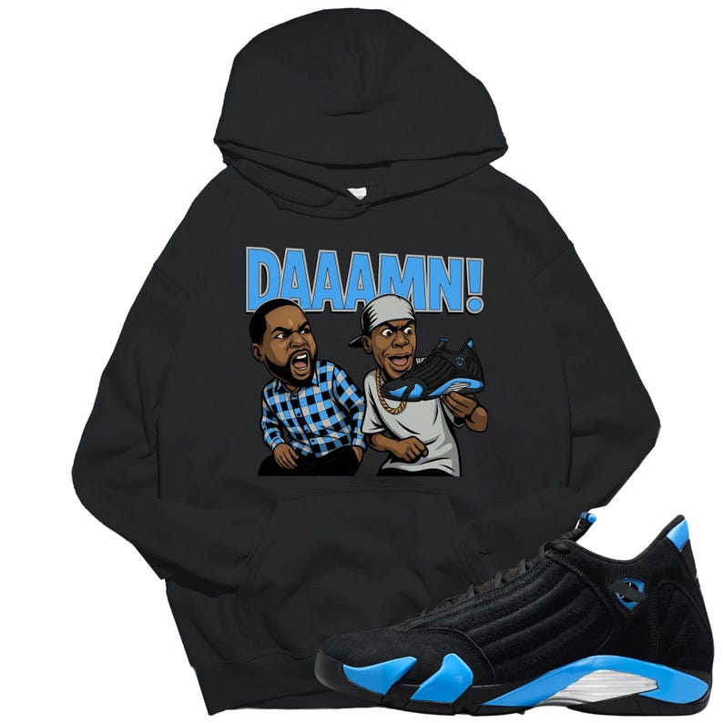 May include: Black hoodie with a graphic of two cartoon figures and the word "DAAAMN!" in light blue. The hoodie is paired with a black and blue sneaker.