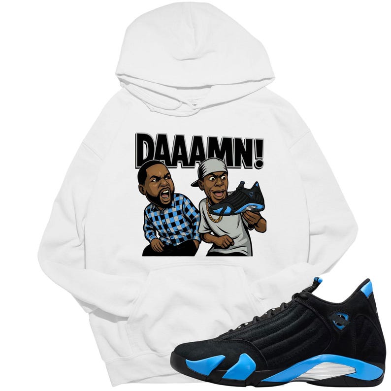 May include: White hoodie with a graphic of two cartoon characters and the word "DAAAMN!". A black and blue sneaker is in the foreground. The hoodie features a drawstring hood and a kangaroo pocket.