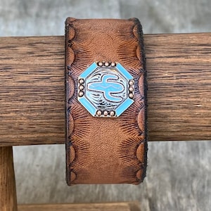Brown tooled  leather armwrist band/wrist cuff/wrist bracelet with cactus screwback concho