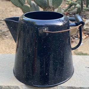 Sold at Auction: 12 GRANITEWARE COWBOY COFFEE POT