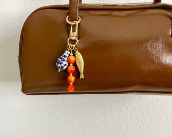 Colorful Beaded Keychain with Ceramic Porcelain Charms, Gold Sardine Fish Charm, Coastal Ocean Bag Charm, Orange Blue Statement Purse Charm