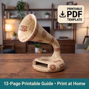 May include: A beige ceramic acoustic amplifier for a smartphone with a speckled finish and brown line art designs including suns and geometric patterns. The base features a rectangular slot for a phone, and the text PRINTABLE PDF TEMPLATE is visible.