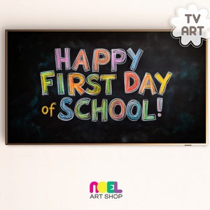 May include: A black chalkboard with a gold frame, featuring the text "Happy First Day of School!" written in colorful chalk.