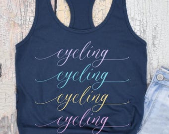 May include: A navy blue tank top with the word "cycling" written four times in different colors. The word is written in a cursive font.