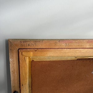 May include: A framed artwork with a wooden frame. The upper left corner of the frame has handwritten text that reads "SARNY VALLEY 2/5/97". The number "91" is written on the top right corner of the frame.