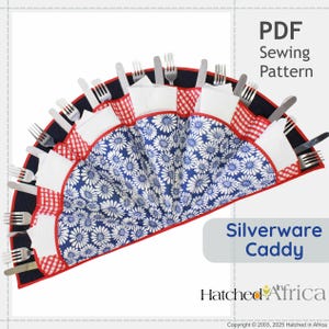 May include: A fan-shaped silverware caddy with a blue and white floral pattern, red gingham accents, and black trim. The caddy holds forks and knives. The text "PDF Sewing Pattern" and "Silverware Caddy" are visible.