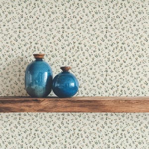 Small scale botanical wallpaper in neutral beige and cream