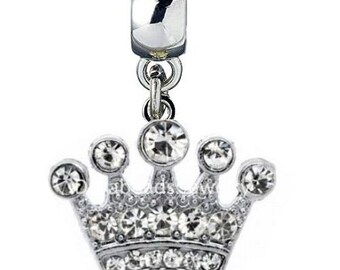 May include: Silver charm with a crystal-encrusted crown pendant. The crown is detailed with a silver base and clear crystals.