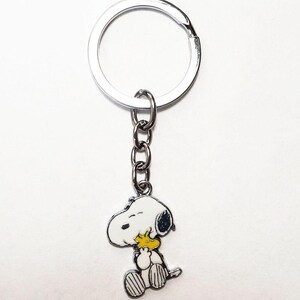 LLavero de SNOOPY y WOODSTOCK con el personaje Peanuts Snuggles, llavero, anillo o bolso, mochila, chaqueta, bolso, billetera, etc., accesorio.