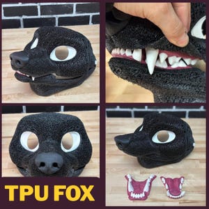 Puede incluir: Máscara de zorro TPU negra con contornos de ojos blancos, una nariz negra y una boca detallada con dientes blancos. La máscara se muestra desde múltiples ángulos, incluido un primer plano de los dientes. El texto "TPU FOX" se muestra en amarillo.