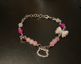 Purple and Pink hello kitty matching bracelets