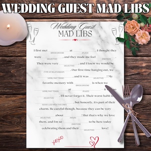 May include: A printable wedding guest mad libs game with a marble background and pink flowers. The game has fill-in-the-blank spaces for guests to write in words to create a funny story about the bride and groom.