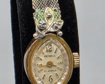 Reloj Benrus 10K para mujer, estilo vintage de los años 60, con correa ajustable.