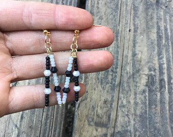 Black and white mismatched dangle earrings