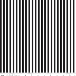 May include: Black and white striped fabric with a ruler showing inches from 1 to 12.