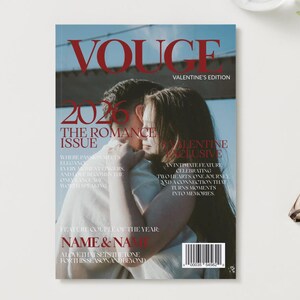 May include: A magazine cover with the title "VOUGE" in red, featuring a couple embracing. The cover reads "2026 The Romance Issue" and "Valentine's Edition". The background is a soft, blurred image.