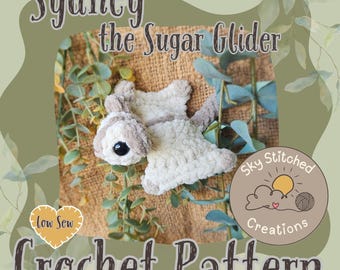 May include: A crochet pattern featuring a sugar glider named Sydney. The plush sugar glider is white and gray with a black eye. The text "Sydney the Sugar Glider" and "Crochet Pattern" are displayed on the image, along with the Sky Stitched Creations logo.