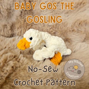 May include: A white crocheted baby gosling with orange beak and feet. The gosling is sitting on a brown fuzzy surface. The text "Baby Gos the Gosling No-Sew Crochet Pattern" is written in brown letters. The text "Sky Stitched Creations" is written in a circle with a sun, cloud, and yarn.