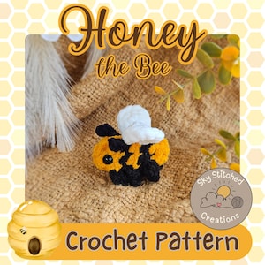 May include: A handmade crochet bee toy with a black and yellow body, white wings, and black eyes. The image features the text "Honey the Bee" and "Crochet Pattern". A logo for "Sky Stitched Creations" is also visible.