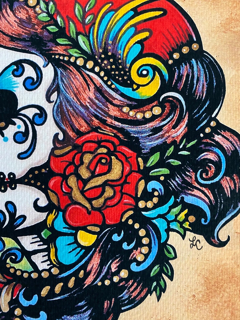May include: A colorful illustration of a sugar skull with a red rose, blue and green floral details, and a yellow bird. The skull is surrounded by black hair with gold beads.