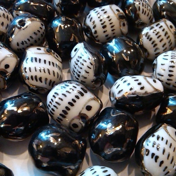 4 cutesy black porcelain beads