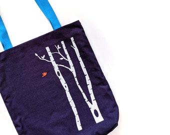 Navy blue tote bag with birch trees and orange bird - screen printed by hand
