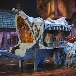 May include: A gray wooden wagon with a canvas top and a wooden wheel. The wagon is decorated with rope and has a small barrel inside. The wagon is a miniature model.