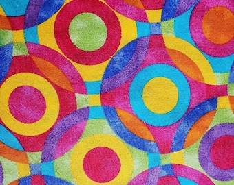 May include: Abstract pattern with overlapping circles in shades of yellow, blue, green, pink, and purple.