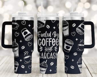 May include: Black stainless steel tumbler with a white design that says "Fueled by coffee and sarcasm". The tumbler has a black lid and a black handle.