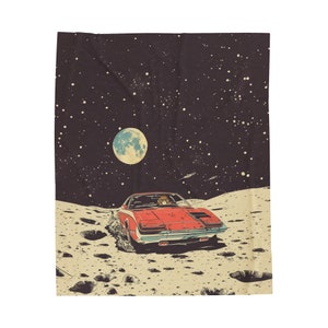 May include: A red car drives on the moon's surface with a person behind the wheel. The car is driving towards a full moon in the night sky.