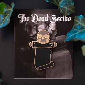 The Dead Scribe | Hard Enamel Pin | Gold & Gray Skull Pin
