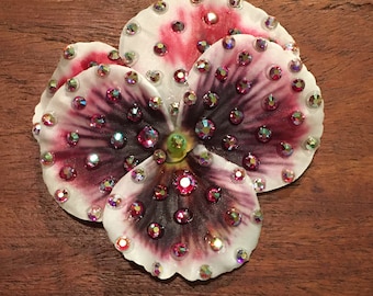 3” fuchsia and white Pansy flower clip adorned with crystal ab and fuchsia Ab Preciosa rhinestones and affixed to a small clip.