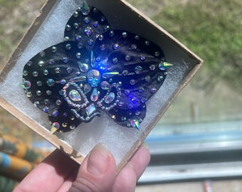 Teschio Swarovski orchidea nera.