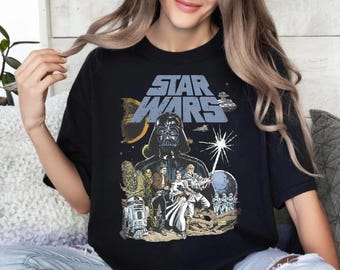 May include: Black t-shirt with a Star Wars graphic. The design features Darth Vader, Chewbacca, R2-D2, and other characters from the film series. The words "STAR WARS" are printed in a blue and white font. The text "Ready To Press DTF" is at the top.