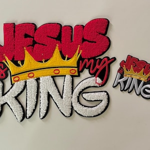 May include: Embroidered patch set with the words "Jesus is my King" in red, white, and black. The design includes a gold crown. A smaller version of the design is also included.