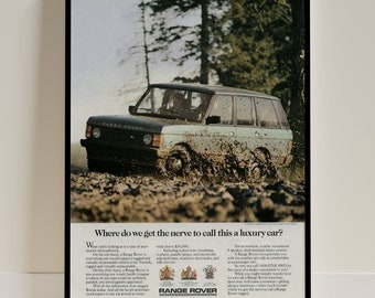 May include: A green Range Rover driving through a muddy forest. The text "Where do we get the nerve to call this a luxury car?" is printed below the image. The Range Rover logo is at the bottom of the ad.