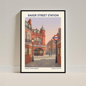 Puede incluir: Impresión enmarcada de la estación de Baker Street en Londres. La obra muestra la fachada de ladrillo rojo de la estación, farolas y el letrero del metro. El texto "BAKER STREET STATION" está en la parte superior.