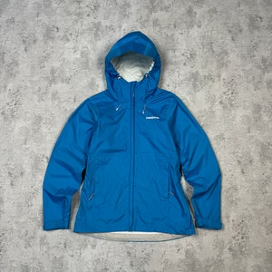 May include: A blue hooded jacket with a zip fastening and the word "Patagonia" printed on the left chest.