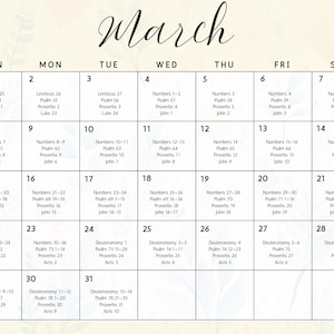 May include: A calendar page for March with a cream background and floral accents. The days of the week are across the top, with dates and Bible verses listed in each box. The word "March" is written in cursive.