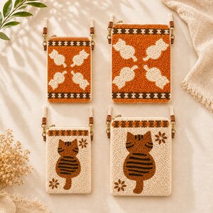 May include: Four rectangular crossbody bags with textured punch needle designs. Two bags feature orange backgrounds with white cat silhouettes and geometric borders. Two bags feature cream backgrounds with brown tabby cat motifs and small flower accents.