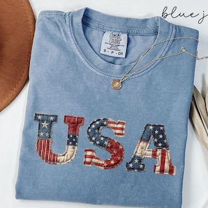May include: A rustic wooden sign with the text "Welcome to our home" in white lettering. The sign features a distressed finish and a simple, inviting design, perfect for entryway decor.